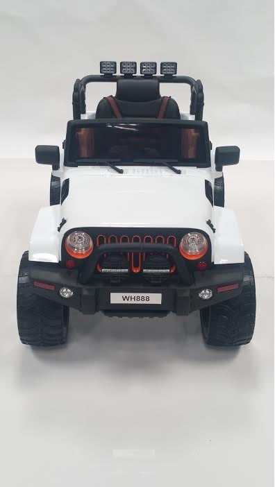 White Jeep Wrangler-style ride-on car with rubber tires